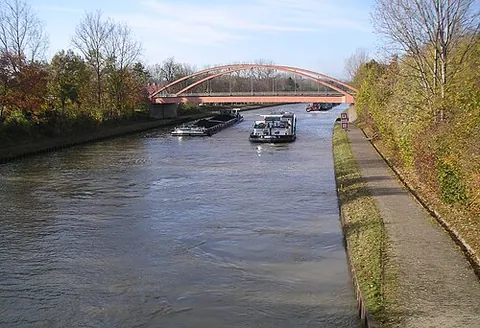 canal: an artificial waterway or artificially improved river used for travel, shipping, or irrigation