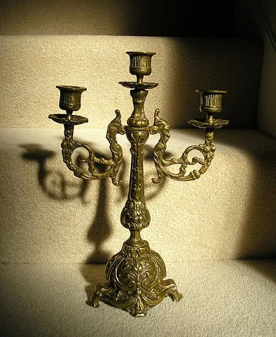 candelabrum: a candle holder with branches to hold more than one candle