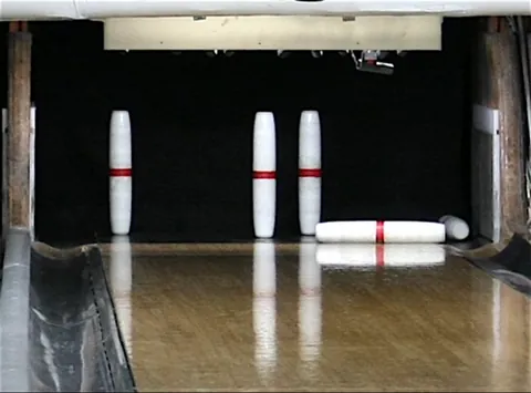 candlepin: a kind of cylindrical tenpin used in a North American regional form of bowling