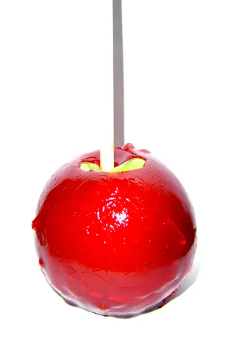 candy apple: an apple with a hard sugar candy coating