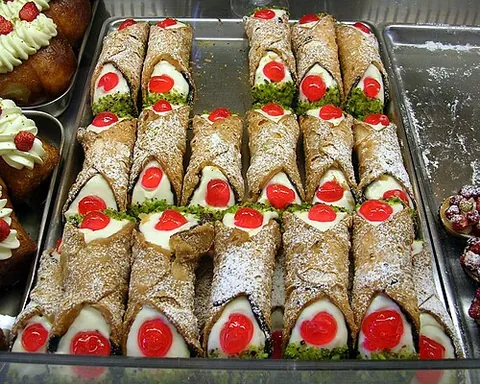 cannoli: a tube of fried pastry, typical of Sicily, filled with ricotta or similar cream cheese, and...