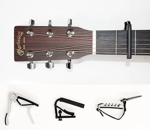 capotasto: a device, placed across the strings of a fretted instrument such as a guitar, to shorten the...