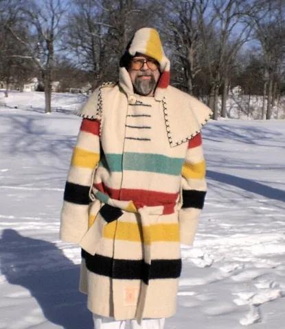 capote: a long coat or cloak with a hood