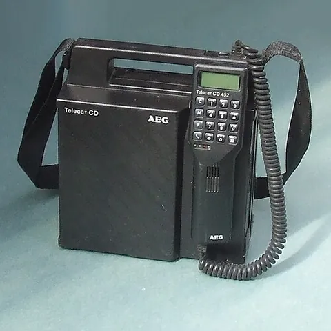 car phone: a mobile phone device specifically designed for and fitted into an automobile