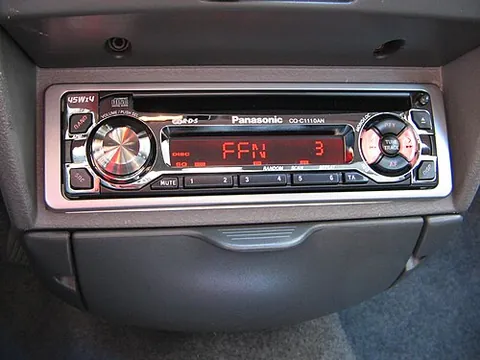 car radio: a radio receiver fitted in a car, typically on or just below the dashboard, sometimes with specific...