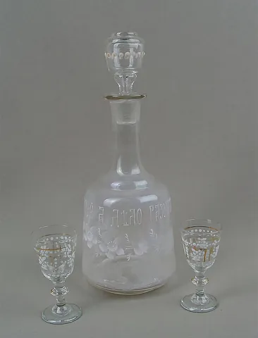carafe: a bottle, usually glass and with a flared lip, used for serving water, wine, or other beverages