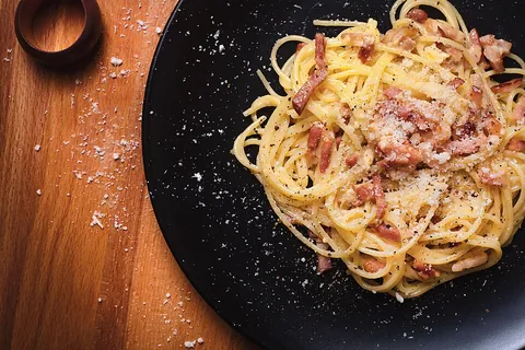 carbonara: a thick Italian pasta sauce, made with guanciale, grated cheese, beaten egg yolks and pepper
