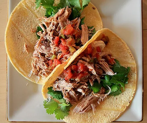 carnitas: a Mexican dish of strips or chunks of pork (or sometimes other meat) which are braised or roasted,...