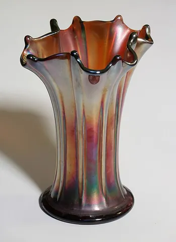 carnival glass: a type of glassware dating from the early 20th century, notable for lustrous colors