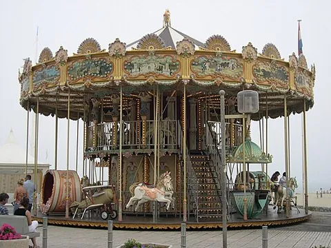 carousel: a pleasure ride, typically found at amusement parks and fairs and accompanied by music, consisting...