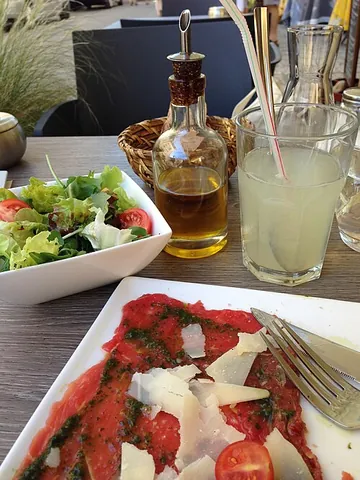 carpaccio: thinly sliced raw beef or tuna, usually served as an appetizer