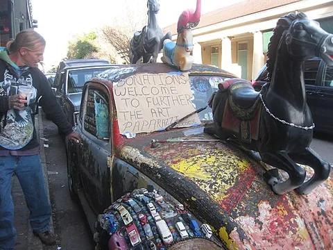 cartist: an artist who transforms automobiles into art cars using unique decorations, materials, and themes
