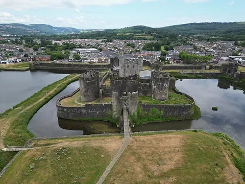 castle: a large residential building or compound that is fortified and contains many defences; in previous...