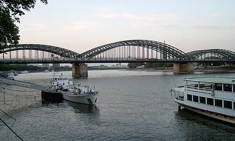 catenary bridge: a bridge in which the horizontal deck is suspended from a reverse catenary to counteract bending