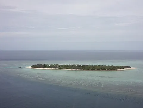 cay: a small, low island largely made of sand or coral