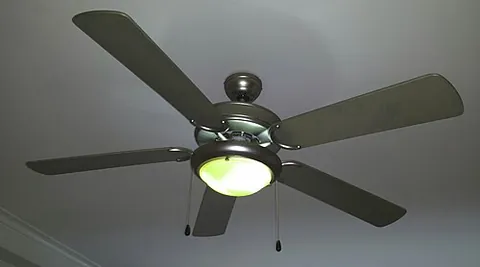 ceiling fan: a fan fixture attached to a ceiling, sometimes with a built-in light