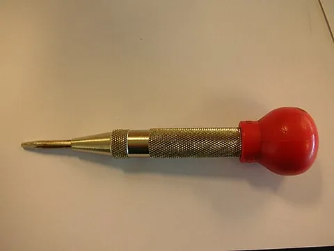 centerpunch: a hand tool used to prepare a workpiece prior to drilling a hole. It typically compresses and then...