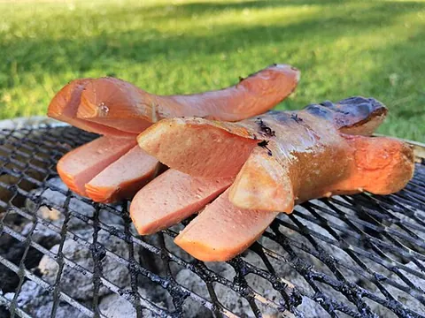 cervelat: a Swiss smoked sausage made with pork or beef