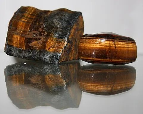 tiger's eye: a chatoyant gemstone that is usually yellow- to red-brown, with a silky lustre