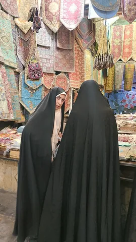 chador: a loose robe made from a single cloth, worn as a combination head covering, veil and shawl by...