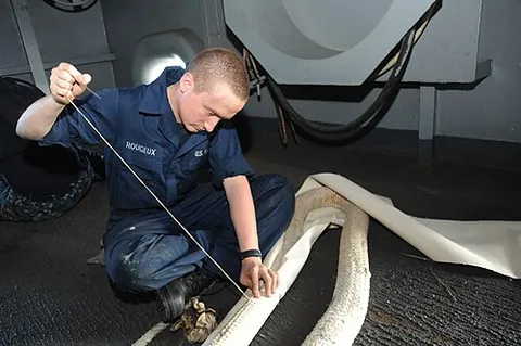 chafing gear: any material, usually rope or canvas, used to protect sails, rigging, etc., at points where they...