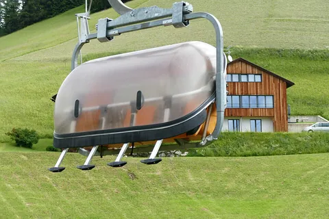 chairlift: a continuously moving series of open seats, slung from overhead cables, used to transport people...