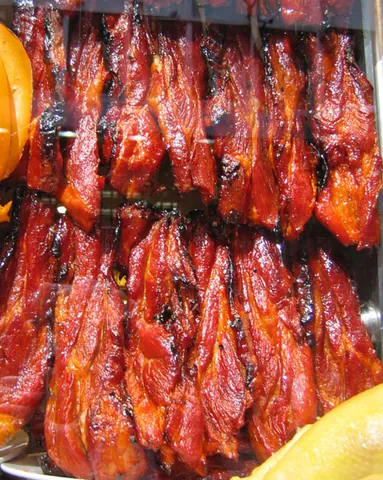 char siu: a style of preparation of barbecued pork in Cantonese cuisine, typically using honey and spices