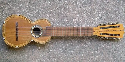 charango: a small guitar-like stringed instrument with five courses of eighteen to fifteen strings,...