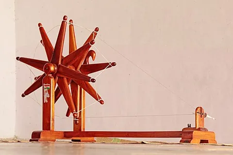 charkha: a domestic spinning wheel, used mostly for spinning cotton
