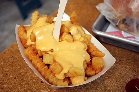 cheese fries: french fries covered or cooked in cheese (especially when grated or melted) or cheese sauce and...