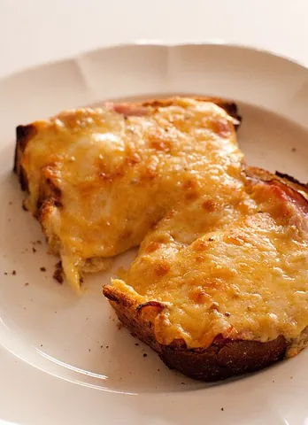 cheese on toast: a snack made by placing cheese on a slice of bread or toast and melting the cheese under a grill