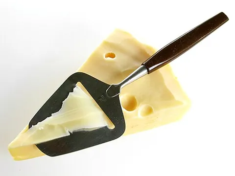 cheese slicer: a kitchen instrument used for slicing cheese