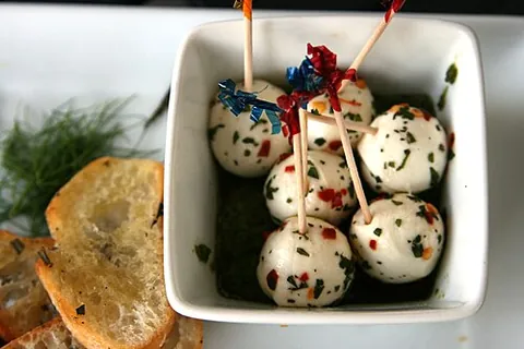 cheeseball: a spherical mass of cheese or cream cheese, often including nuts or other additions and served as...