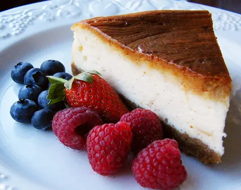 cheesecake: a pie made of sweetened and flavoured cottage cheese or cream cheese, eggs and milk on a crunchy...