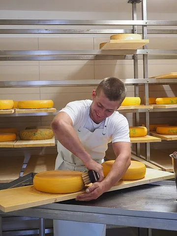 cheeseman: a man who makes cheese