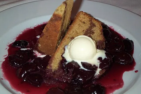 cherries jubilee: a dessert of cherries and liqueur (typically Kirschwasser), flambéed and typically served as a...