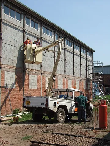 cherry picker: a piece of equipment consisting of a large basket at the end of an extensible boom, often mounted...