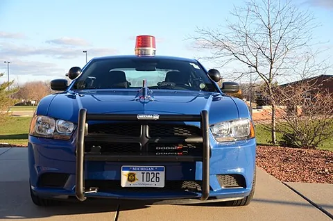 cherrytop: a round, red light that is mounted on top of a police car