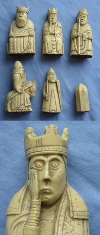 chess piece: any of the 16 white and 16 black pieces used in playing the game of chess