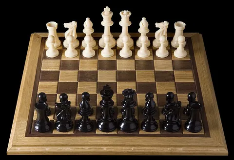 chess: a board game for two players, each beginning with sixteen chess pieces moving according to fixed...