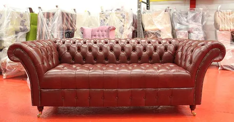 chesterfield: a couch, sofa, or love seat with padded arms and back of the same height, often curved outward at...