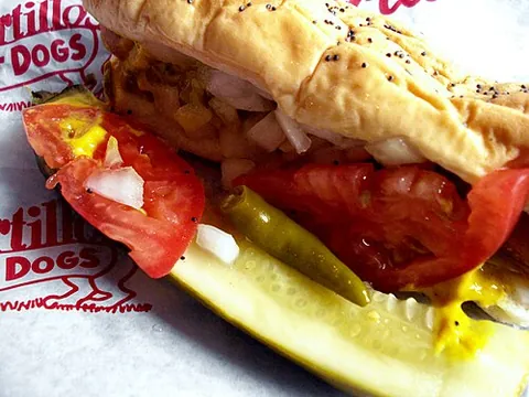 chicago-style hot dog: a beef hot dog served with mustard, onion, relish, peppers, tomato, and a pickle on a poppy seed bun
