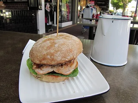 chicken burger: a sandwich consisting of a piece of boneless, sometimes fried chicken served in a bun, typically...