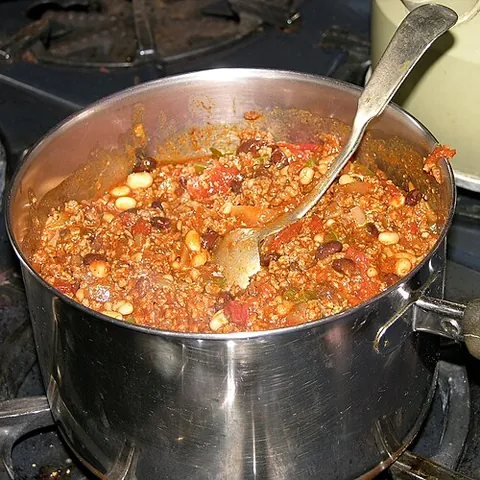 chili con carne: a dish of meat and beans in a tomato sauce flavoured with chili peppers