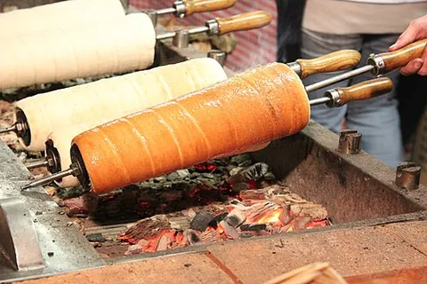 chimney cake: a kind of long, cylindrical Hungarian pastry made from sweet yeast dough and roasted over charcoal,...