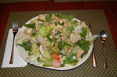 chinese chicken salad: a salad, common in parts of the United States, made with chopped chicken and other ingredients such...