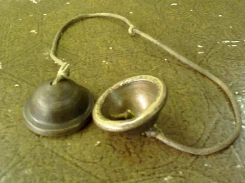ching: a pair of small bowl-shaped finger cymbals made of thick and heavy bronze, used in the music of...