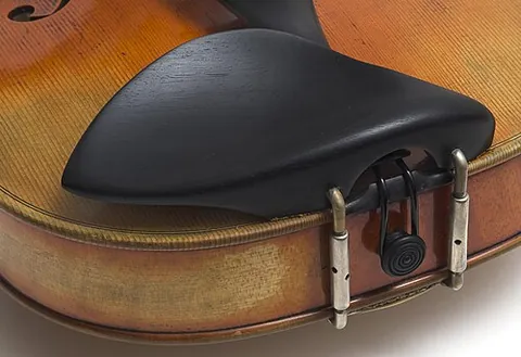 chinrest: a shaped piece of wood, plastic, etc. attached to the body of a violin or viola to aid in the...