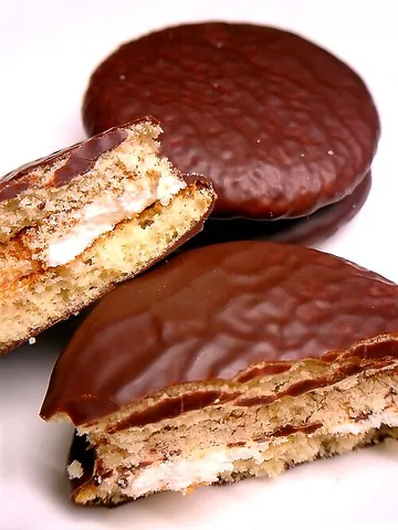 choco pie: a snack consisting of two small round layers of cake covered in chocolate with marshmallow filling
