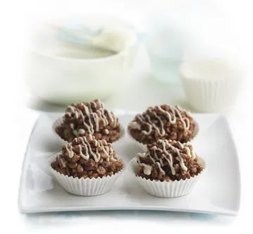 chocolate crackle: a snack made from a mixture of Rice Bubbles, desiccated coconut and hydrogenated coconut oil left...